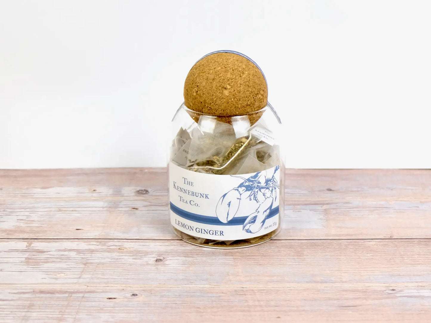 Lemon Ginger Tea filled tea bags stored in a glass jar