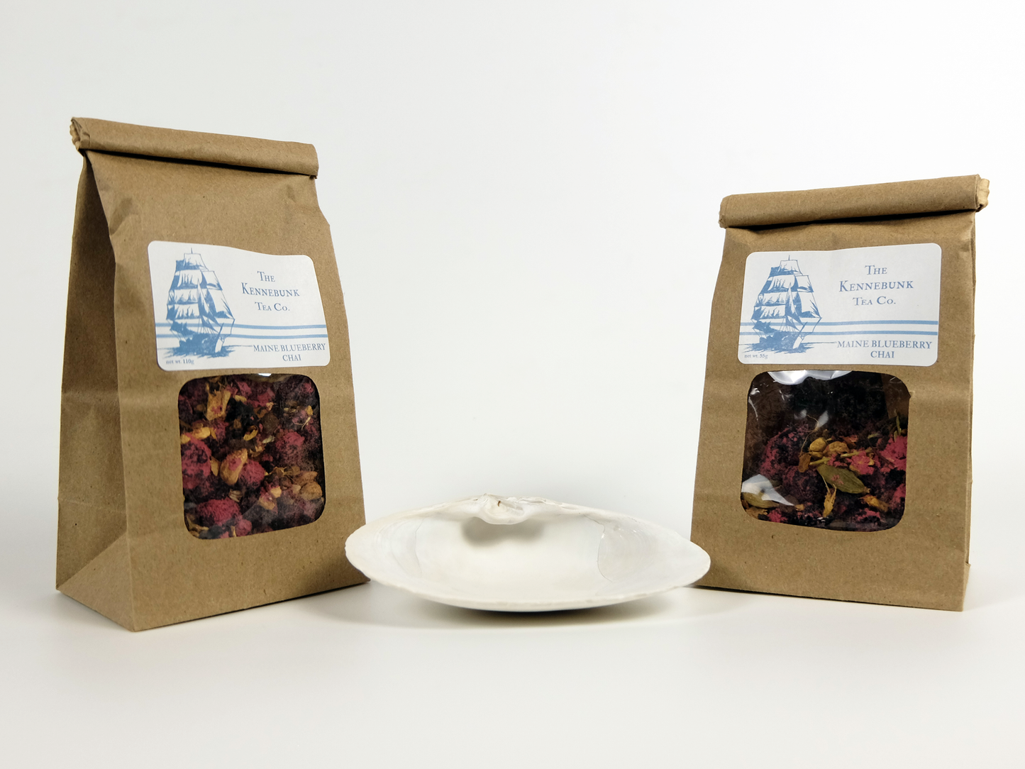 Maine Blueberry Chai loose leaf tea with two refill tea bags behind