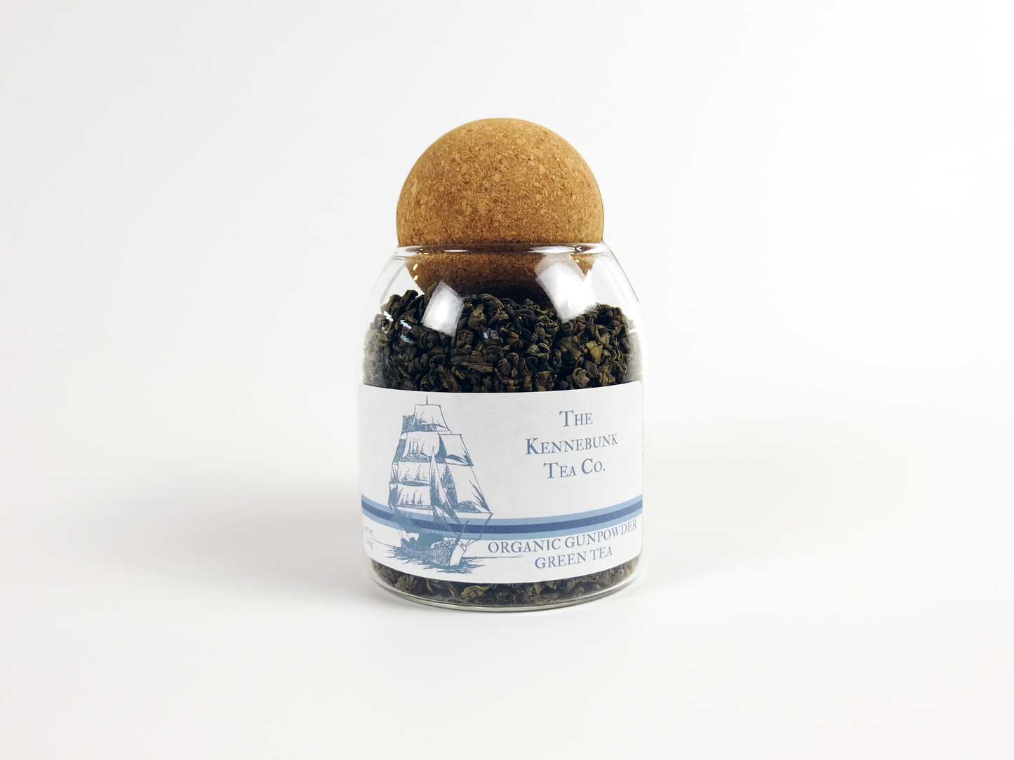 Organic Gunpowder Green Tea loose leaf tea in a glass jar with Clipper Ship label