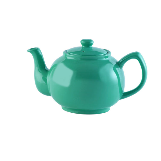Jade green ceramic teapot with lid and curved handle on a white background