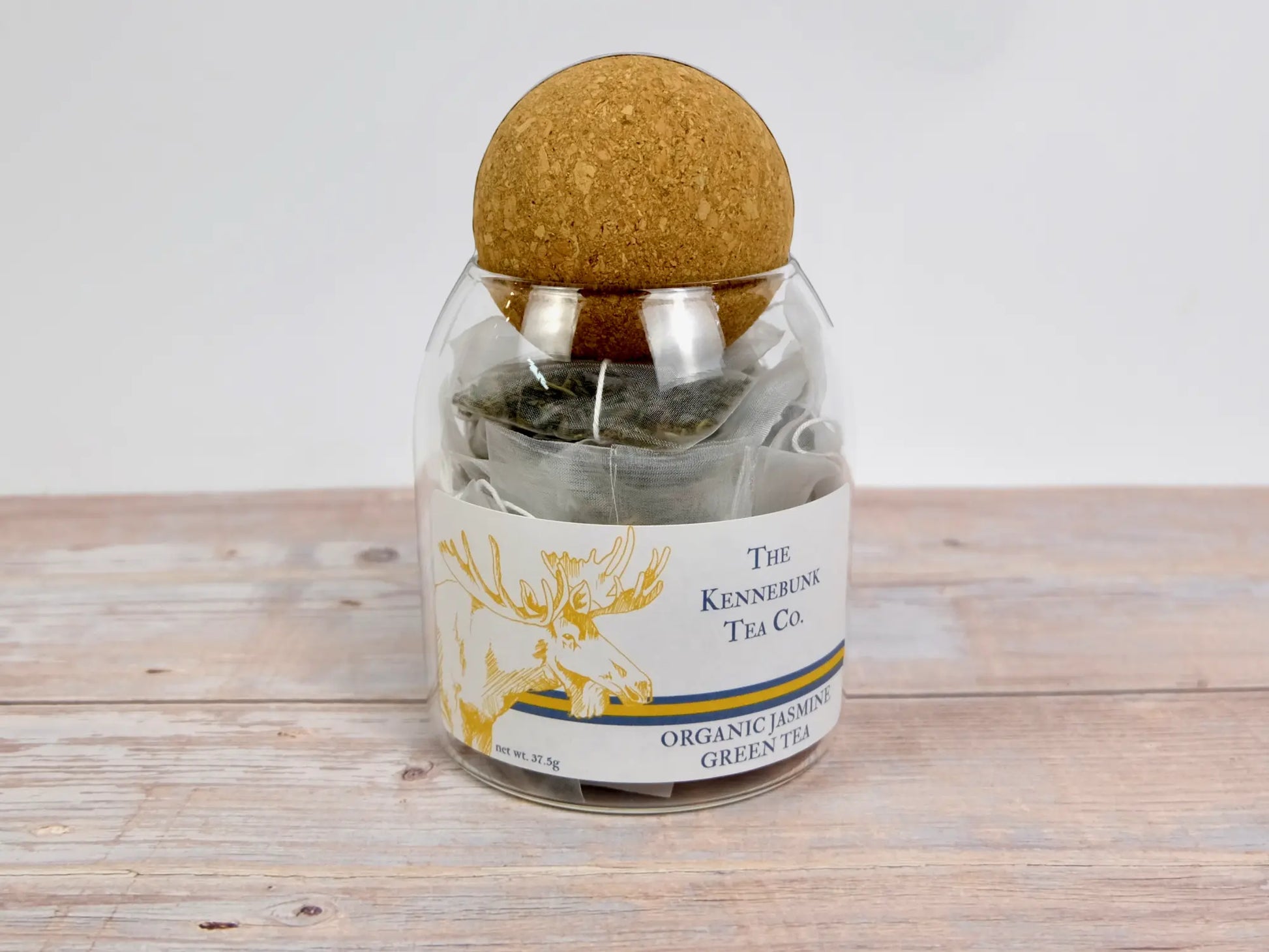 glass jar filled with jasmine green tea bags