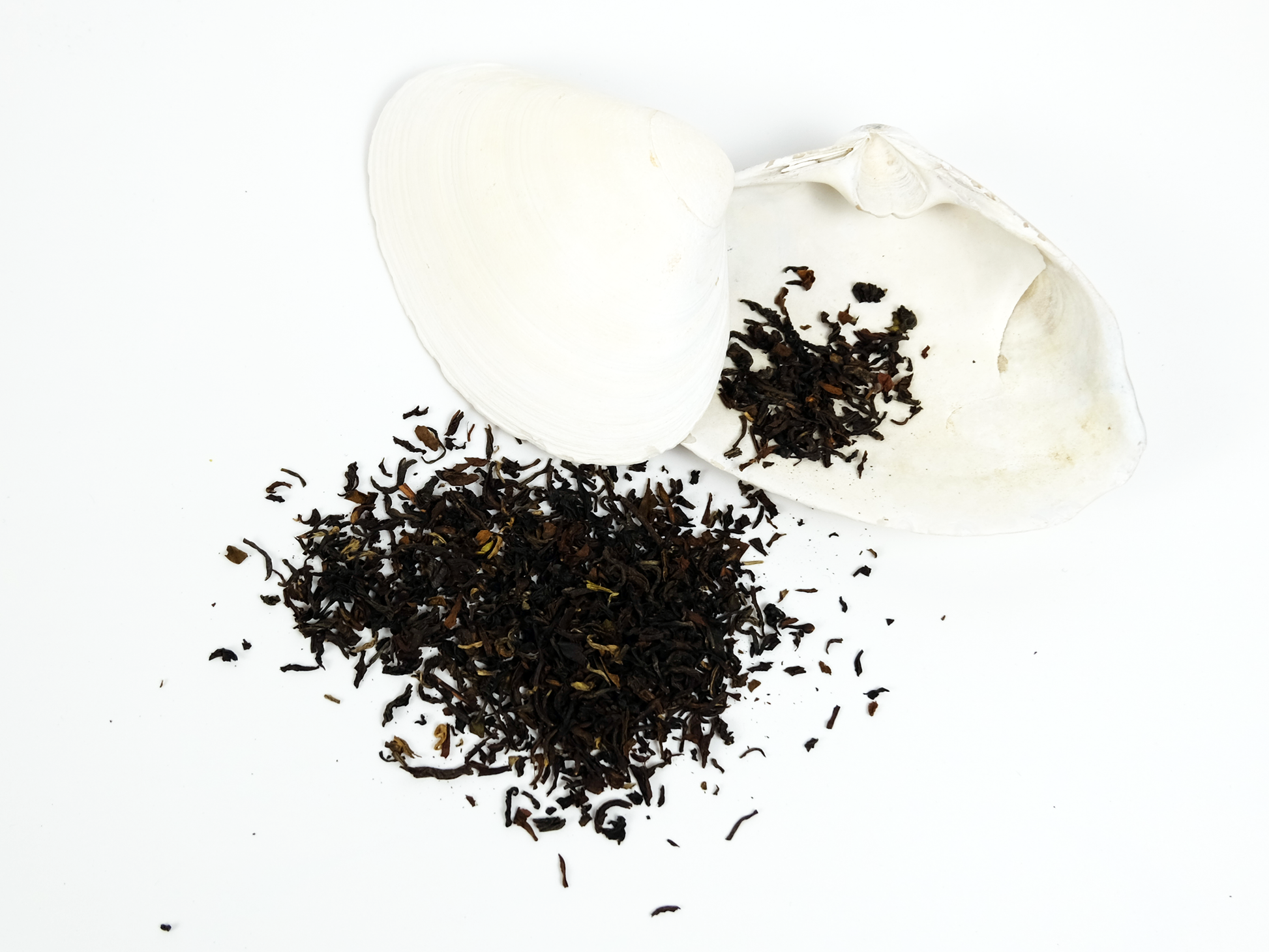Orange Valley second flush Darjeeling loose leaf tea on a white shell