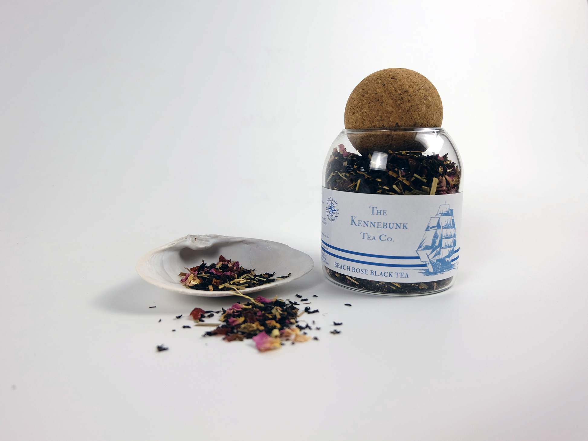 Beach Rose Black Tea loose leaf tea in a glass jar with shell and Clipper Ship label
