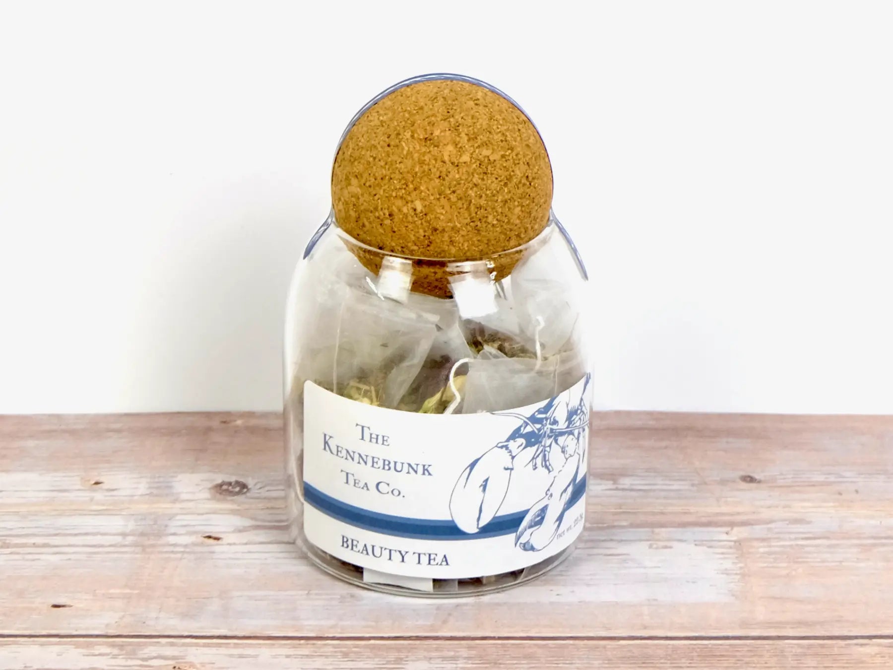 Beauty Tea teabags in a glass jar with Lobster Label