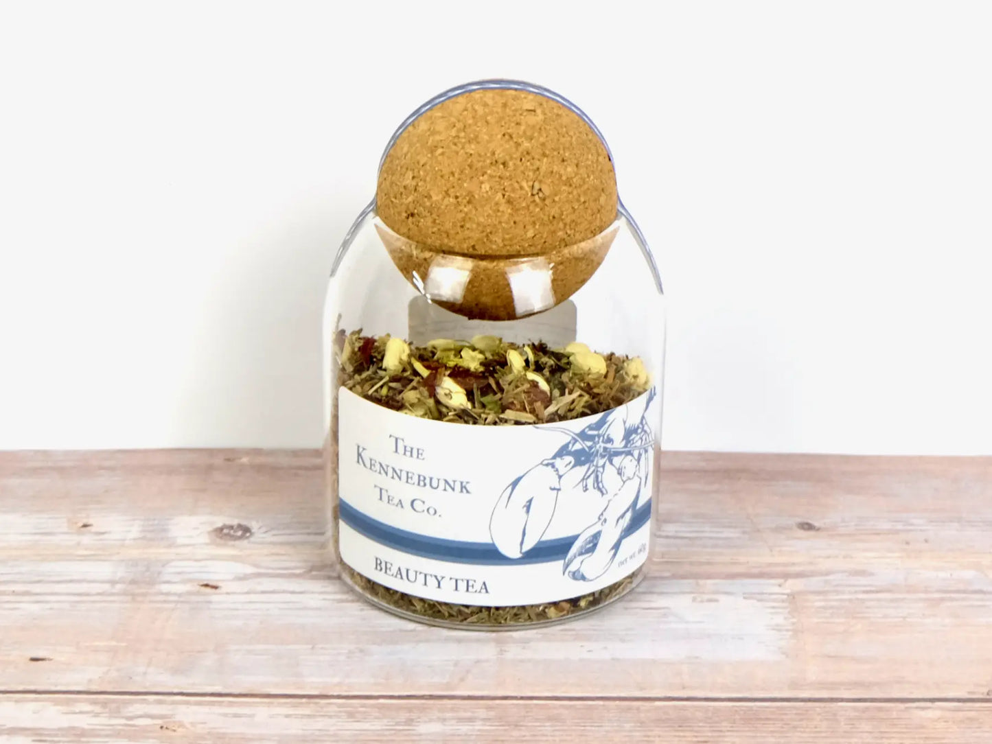 Beauty Tea loose leaf tea in a glass jar with Lobster Label