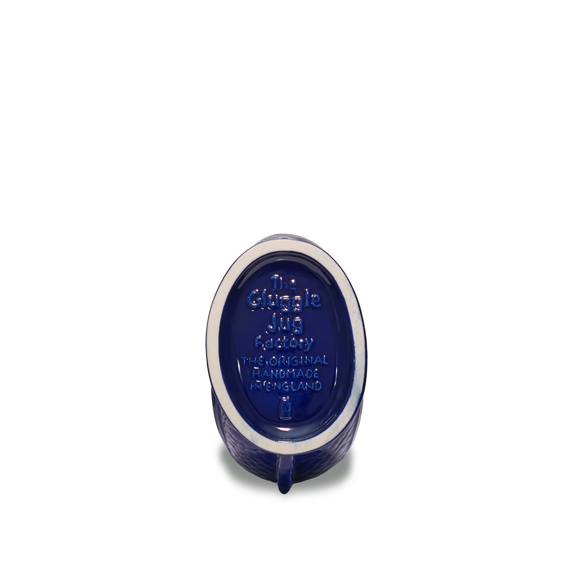 Cobalt blue ceramic product with 'The Gluggle Jug Factory handmade in England' text on a white background