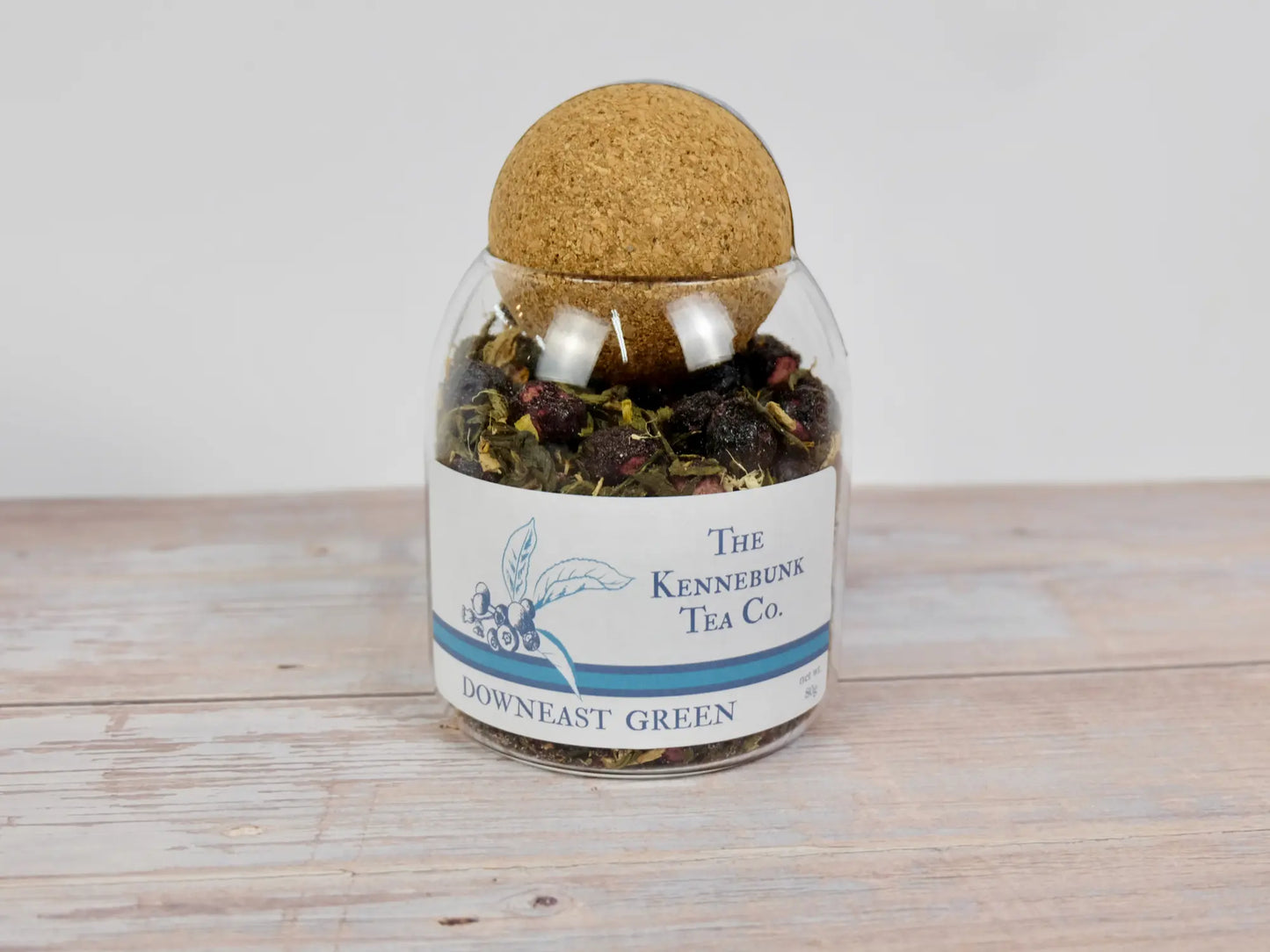 Downeast Green Tea loose leaf tea in a glass jar with Blueberry label