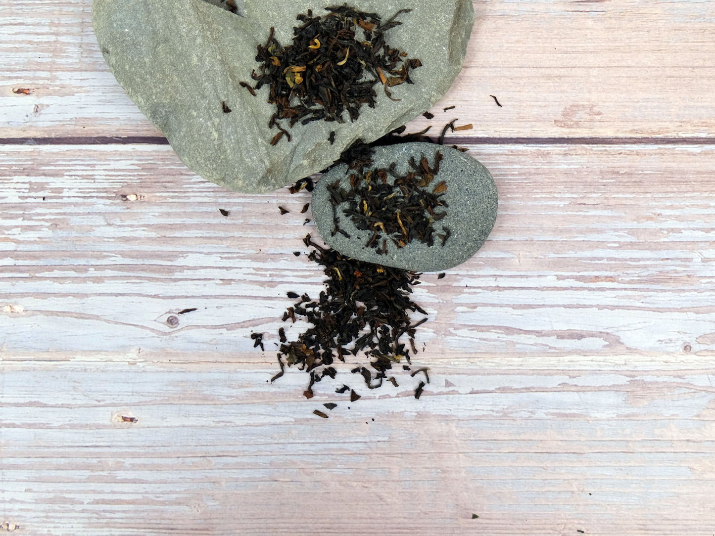 Earl Grey Tea loose leaf tea spread over rocks