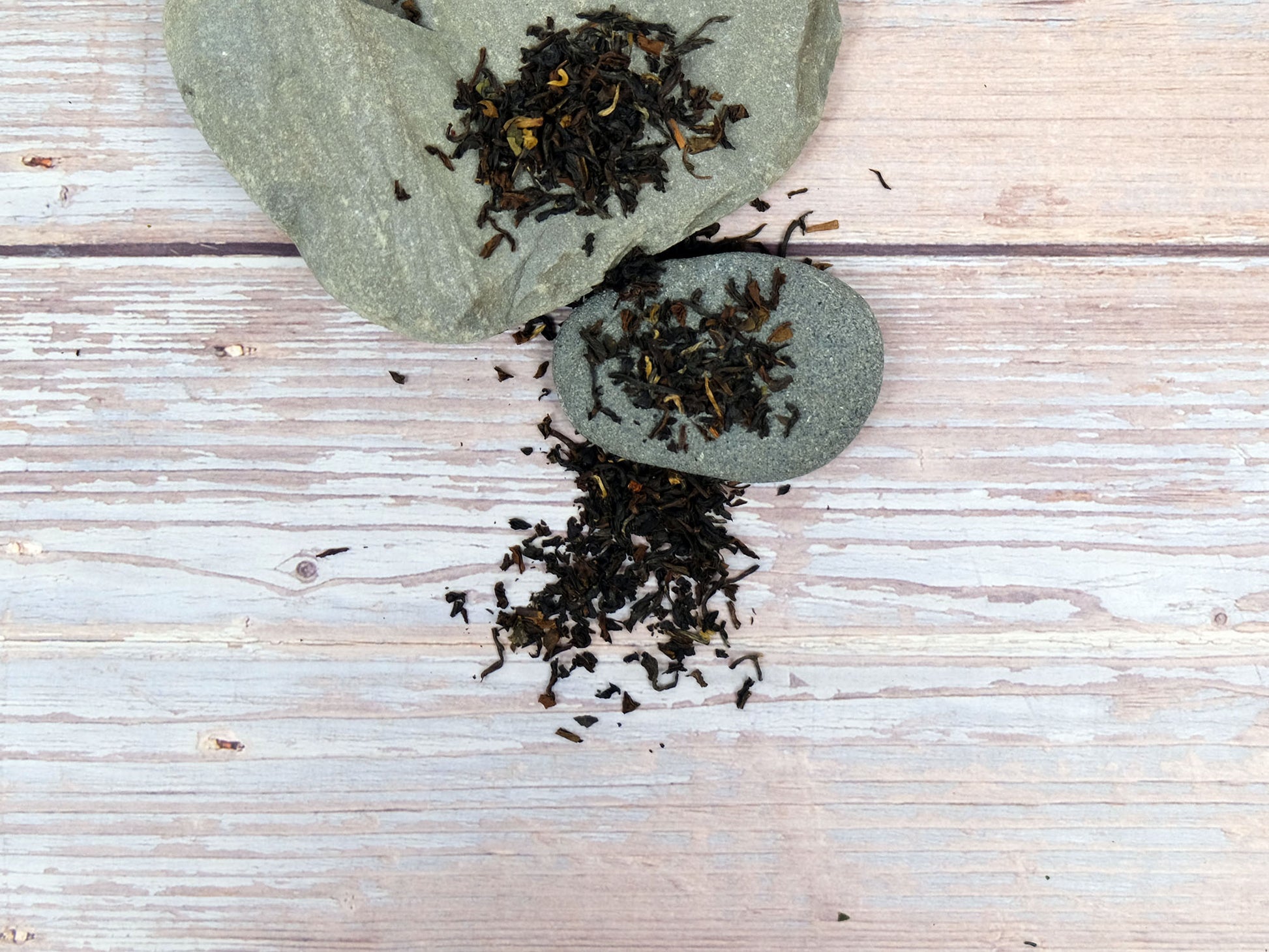 Earl Grey Tea loose leaf tea spread over rocks