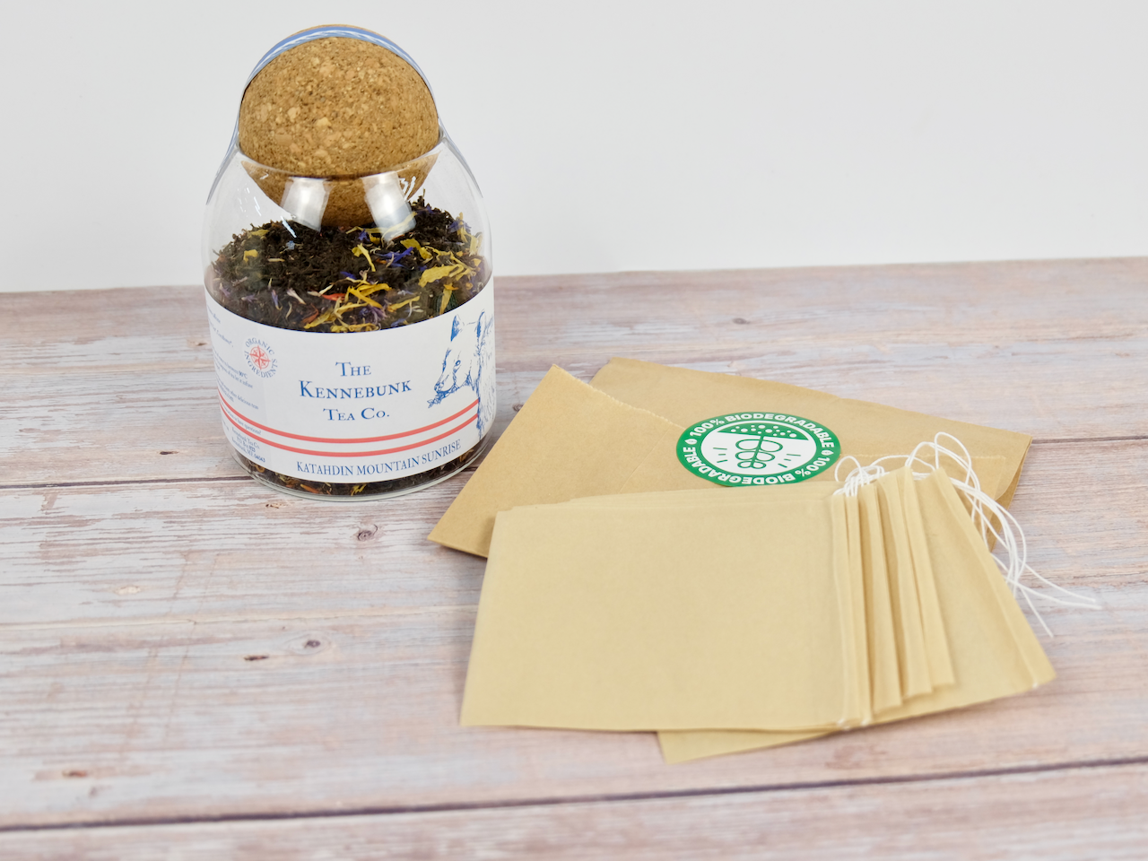 Katahdin Mountain Sunrise Tea empty teabags in a glass jar with bear label