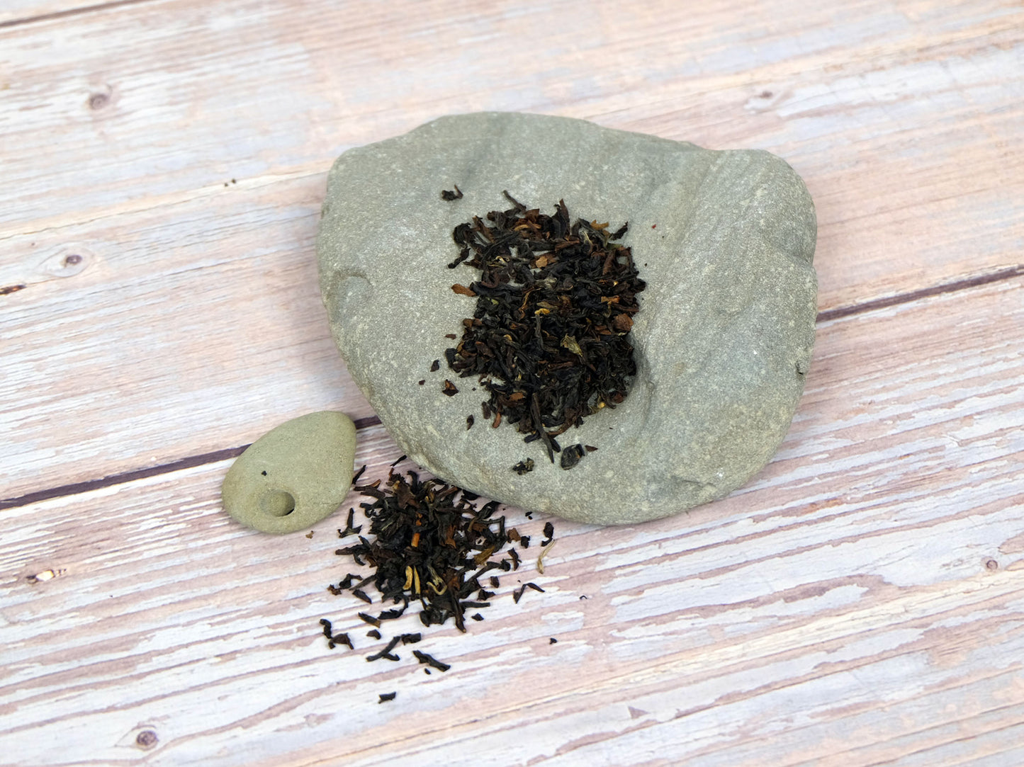 Organic Darjeeling Tea loose leaf tea on rocks, secondary shot