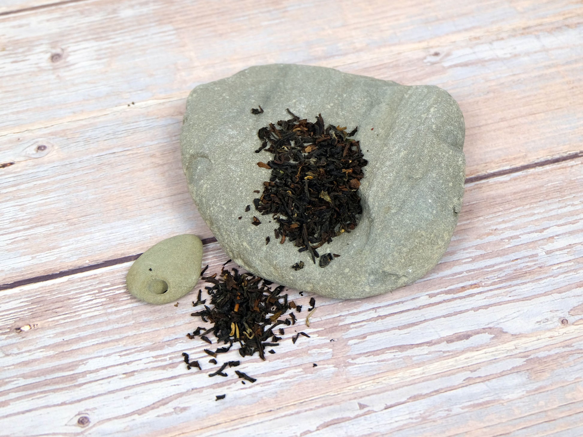 Organic Darjeeling Tea loose leaf tea on rocks, secondary shot