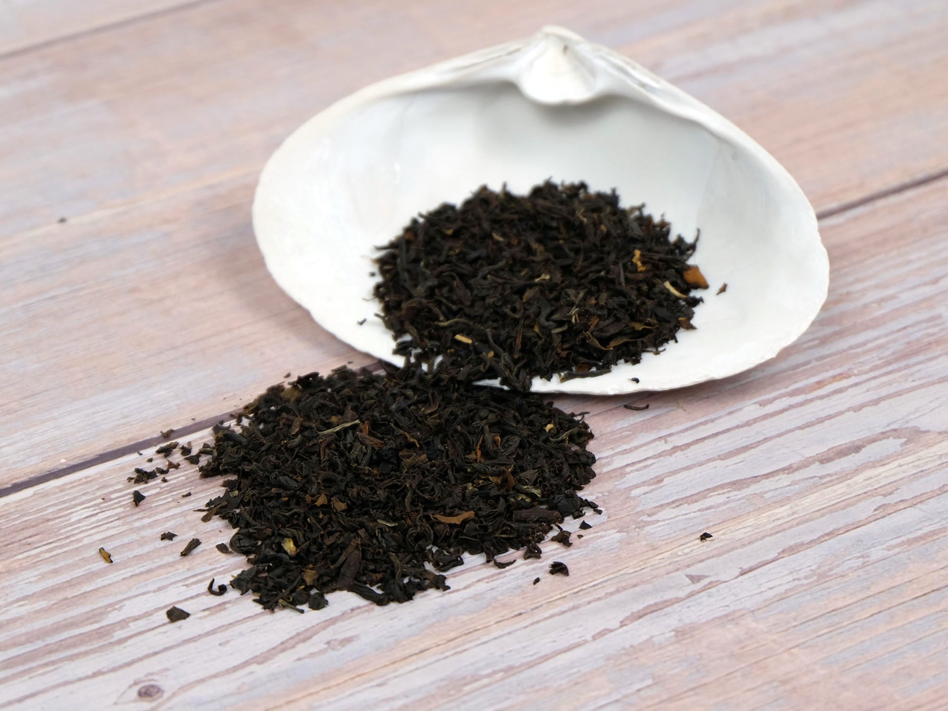 Organic English Breakfast Tea loose leaf tea displayed on a white shell