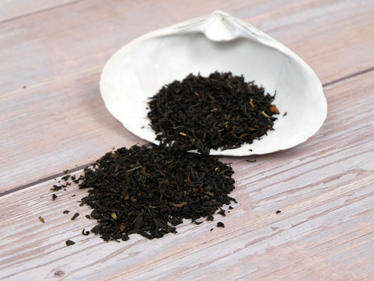 Organic English Breakfast Tea loose leaf tea displayed on a white shell