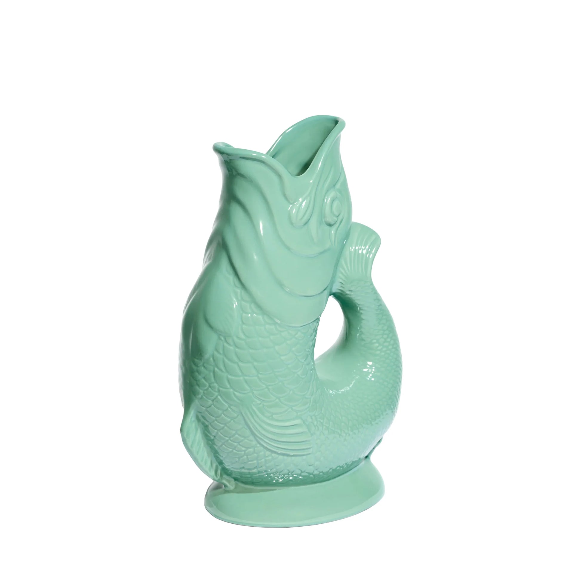 Sea green fish-shaped gluggle jug on a white background